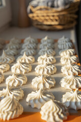 Rustic kitchen scene with meringue cookies
