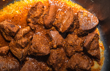 A traditional Bengali dish, known as Goat Liver Curry or mutton 