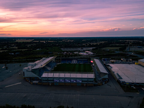 An aerial view at sunset of the Colchester  Community Stadium, home of Colchester United in Essex, UK
