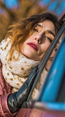 the young woman, resting her head on the car window, was immersed in the emotions of contemplation,