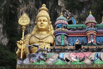 Golden Statue of Lord Murugan (Kartikeya) at Batu Caves Temple, Malaysia – Hindu deity sculpture, Tamil culture, monumental religious landmark
