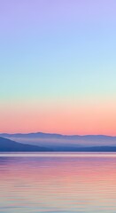 Serene Coastal Sunset with Soft Gradient Sky and Calm Waters