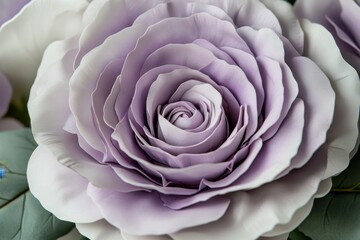 Close-up view of a sculpted, lavender-colored rose.