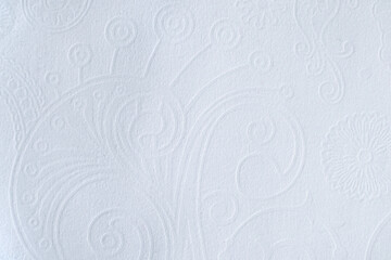 White embossed wallpaper with floral and swirl patterns for elegant home decor