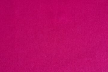 Bright magenta fabric texture background with a seamless and uniform pattern