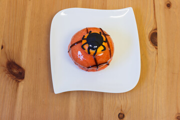 Creative Halloween cake on wooden table
