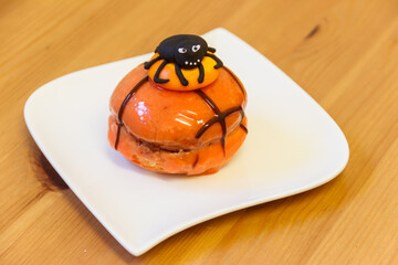 Creative Halloween cake on wooden table