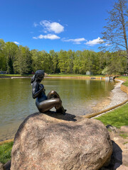 Sculpture of a swimming woman on Swan Lake in the Minsk Botanical Garden, Belarus