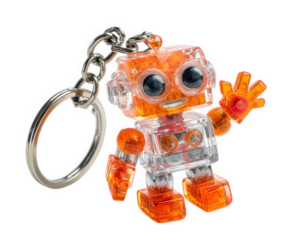 Transparent orange robot keychain with waving hand, smiling face, and metallic ring, isolated on transparency background, playful and cute collectible accessory