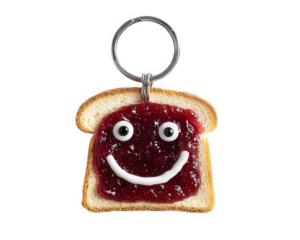 Toast keychain with jam smiley face, playful breakfast accessory, isolated on transparency background, cute food charm, fun gift idea, low resolution image