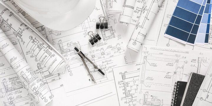 architect design working drawing sketch plans blueprints and making architectural construction model in architect studio,flat lay.