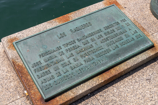 Santander, Spain. The Raqueros monument by the waterfront shows bronze figures of boys near the bay, capturing a moment of local maritime history and daily life