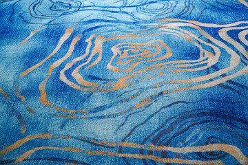 Intricate patterns in shades of blue, tan and white creating a visually captivating design. This...