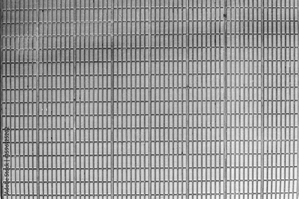 Poster monochrome metallic grid offers a textured surface with a repetitive rectangular pattern. the gray t