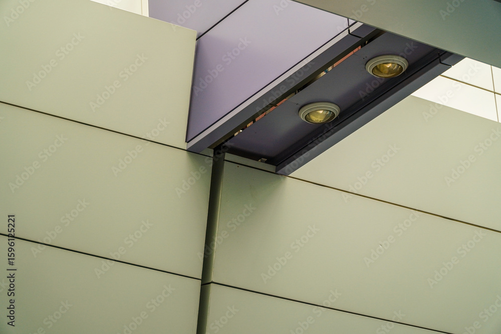 Poster a modern architectural detail showcasing sharp lines and geometric shapes, emphasizing the interplay