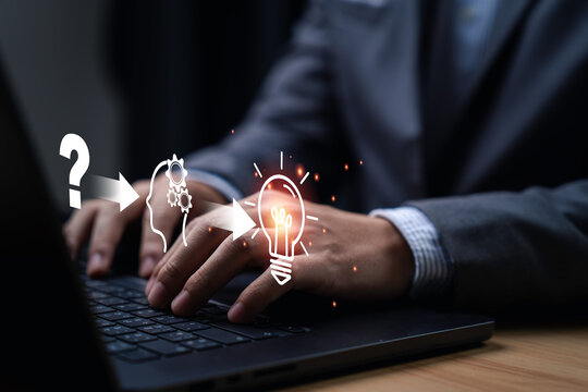 Businessman using laptop with icon from questioning to understanding and finally achieving an idea. It symbolizes the process of thought and innovation, highlighting creativity and problem-solving.