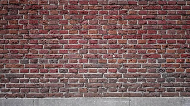 Textured red brick wall background showcasing a pattern of rustic bricks with natural wear, highlighting construction and durability.