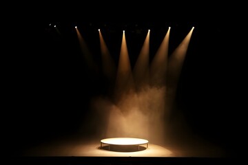 Dramatic stage lighting illuminates empty circular platform; atmospheric, moody, theatrical setting.