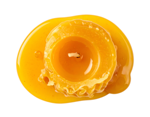 melted yellow candle top view with oozing wax drops, isolated on transparent background for wellness or spa design
