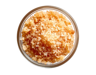 exfoliating body scrub made of natural brown sugar and sea salt in a clear glass bowl for skincare and spa treatment on isolated background
