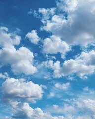 Naklejka premium Puffy white clouds floating in a bright blue sky