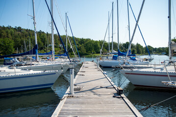Fototapeta premium Yachts Moored at Marina Dock on a Sunny Day