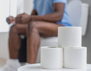  Person Sitting on Toilet in Bathroom Scene
