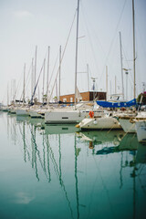 Seascape with yachts and boats, with reflection in the water