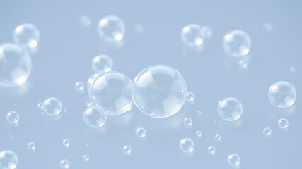 Transparent soap bubbles floating on a light blue surface with selective focus photography