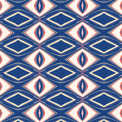 Seamless geometric diamond pattern in blue, red, and cream tones. Bold and abstract design perfect for textiles, wallpapers, and digital backgrounds.