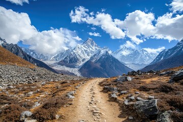 Obraz premium A scenic mountain trail winds through a rugged landscape.