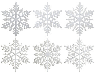 Arrangement of six pristine white snowflakes showcasing unique crystalline forms