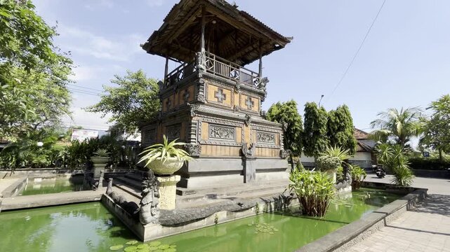 Traditional Balinese Pavilion Surrounded by Green Ponds and Tropical Plants in Singaraja City Park, Bali, Indonesia