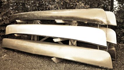 Canoes for Sale and for Rent.  Sepia Tone. 