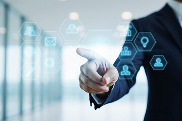 Close-up of male hand in suit interacting with glowing blue hexagonal AI and technology  symbols