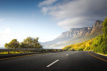 Scenic Coastal Road through Cape Town Suburbs with Mountains and Ocean View