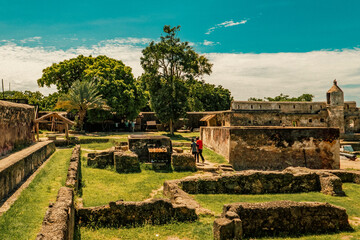 Two friends exploring the Ruins of Fort Jesus in the coastal town of Mombasa, Kenya 