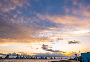 sweet gold sunset winter and light illumination from Cityscape of Yokohama city, Skyline and office building and downtown in  Minatomirai Area, Yokohama city port, Kanagawa, Japan