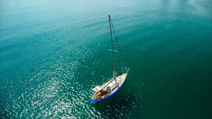 Sailboat Drifting on Turquoise Water