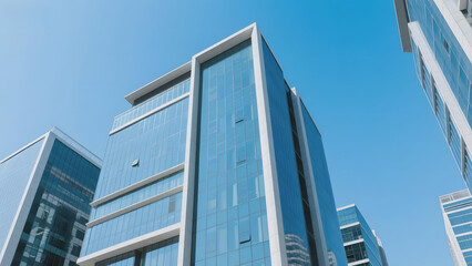 Modern glass skyscrapers under a clear blue sky