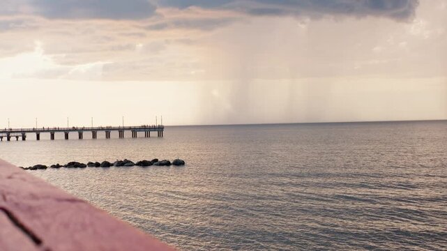 View from the beach of the pier before the storm in the city of Palanga, Lithuania