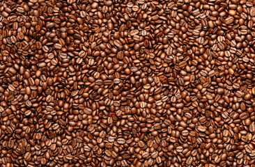 Roasted coffee beans close-up. Brown aromatic beans forming a natural seamless texture. Perfect for backgrounds, café menus, packaging, or design templates related to coffee.