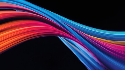 Vibrant flowing abstract waves of color against a dark background, creating a dynamic visual effect