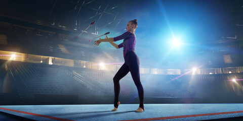 Rhythmic gymnastic girl on professional 3-d gymnastic stadium in night. 
