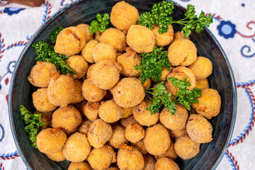 A Close up of Crispy and Creamy Spanish Croquetas. Concept: The contrast of textures.