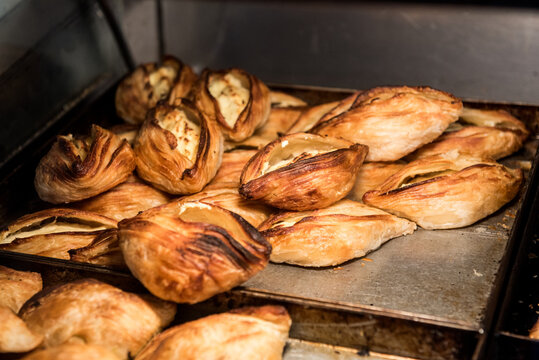 View of Pastizzi inside a bakery shop at the city of Sliema in Malta. A pastizz is a traditional savoury pastry from Malta. Pastizzi usually have a filling either of ricotta or mushy peas.