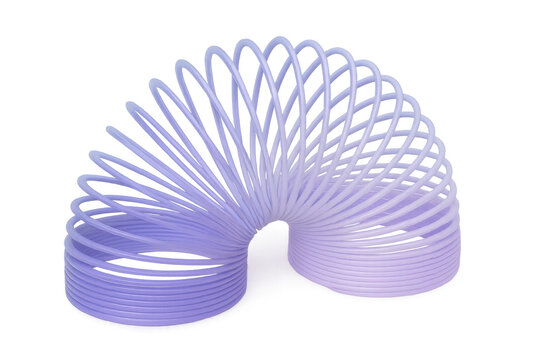 Purple metal spring toy slinky balancing in equilibrium on transparent background, ready for fun and games