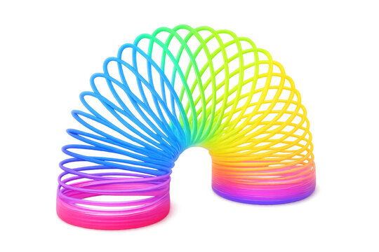 Colorful flexible rainbow spiral toy on transparent background, creating a vibrant and playful image