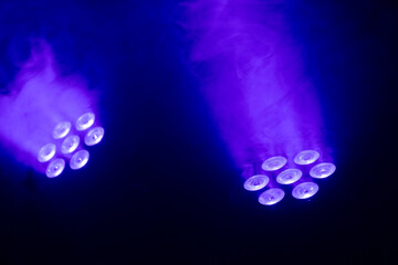 RGB stage lights with blue smoke. Concept: Show, show, technology, lighting.