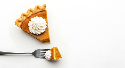 A slice of pumpkin pie with whipped cream on top and a fork holding a bite against a white background